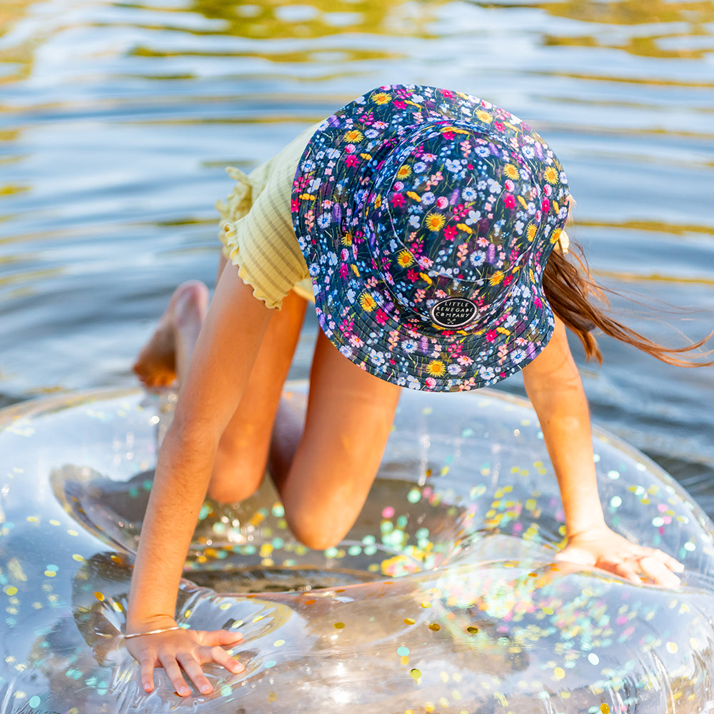 Little Renegade reversible swim hats at the beach