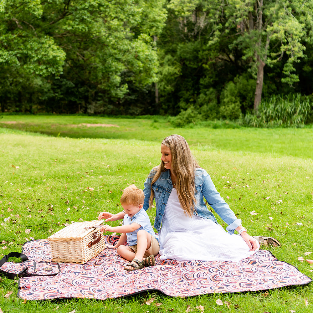 Parent and child using the Arizona Adventure Mat outdoors