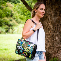 Aussie Natives Adventure Mat folded into its built-in carry bag and worn over the shoulder
