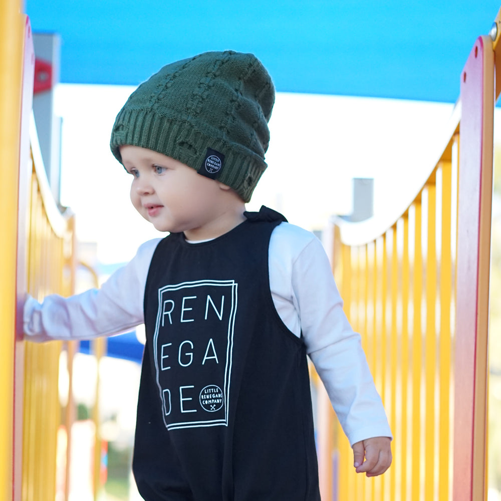 Child wearing the Olive Green Everest Beanie while walking at the playground