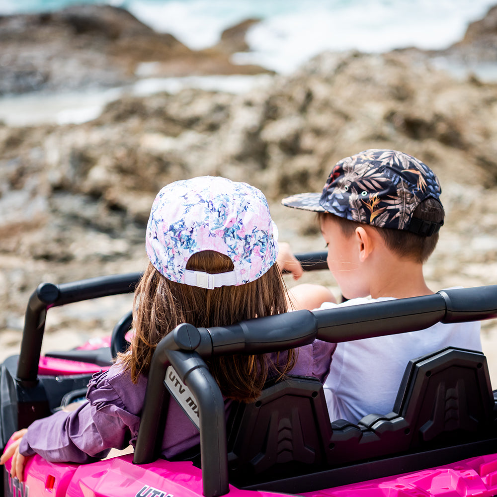 Kids wearing Little Renegade 5 Panel Caps on an outdoor adventure