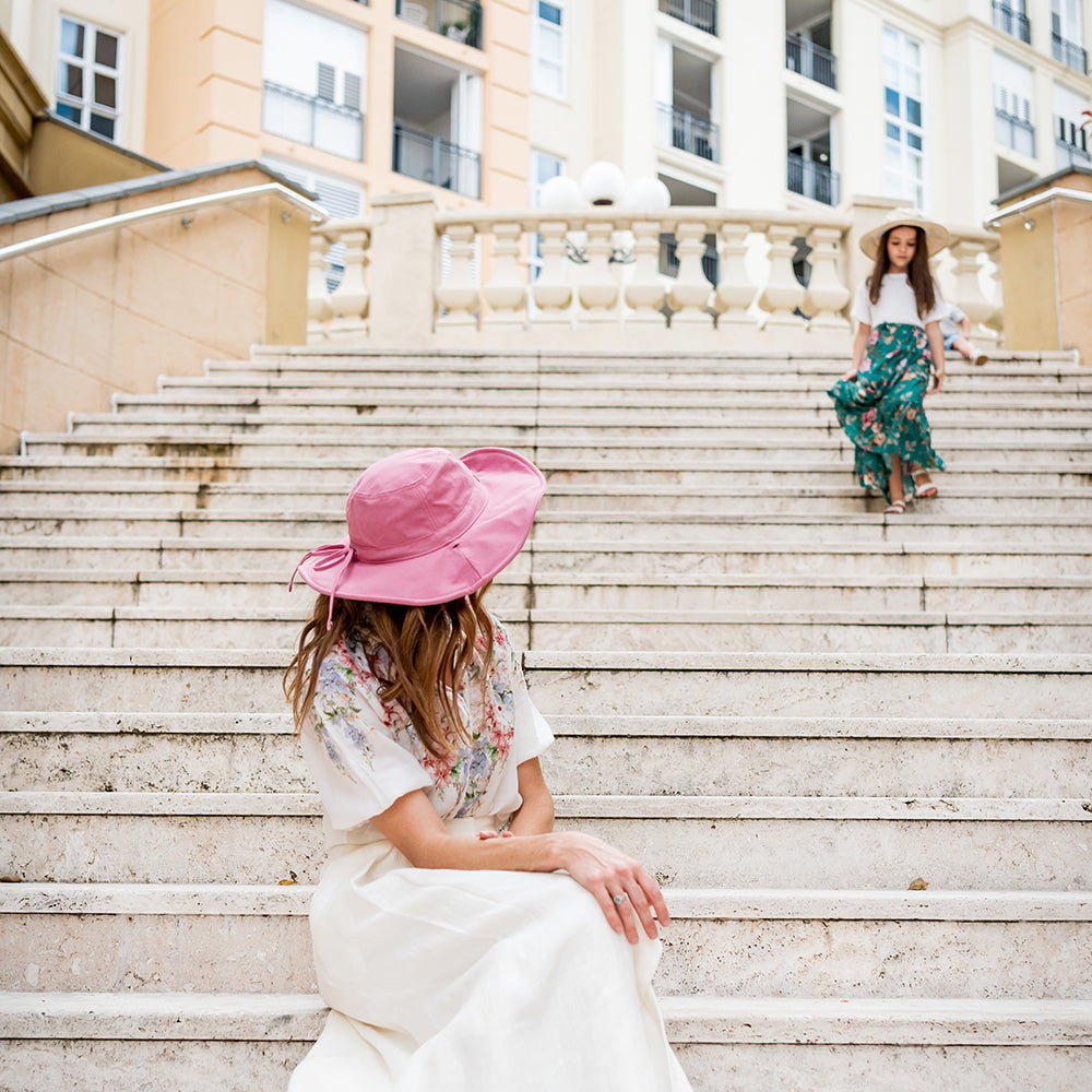 Child wearing a Little Renegade linen Sun Hat outdoors
