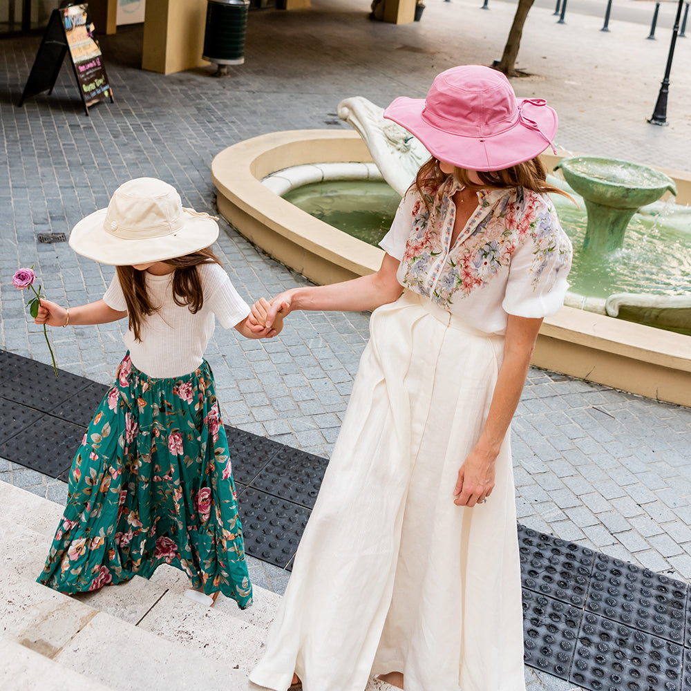 Child wearing a Little Renegade Sun Hat on a sunny outdoor day