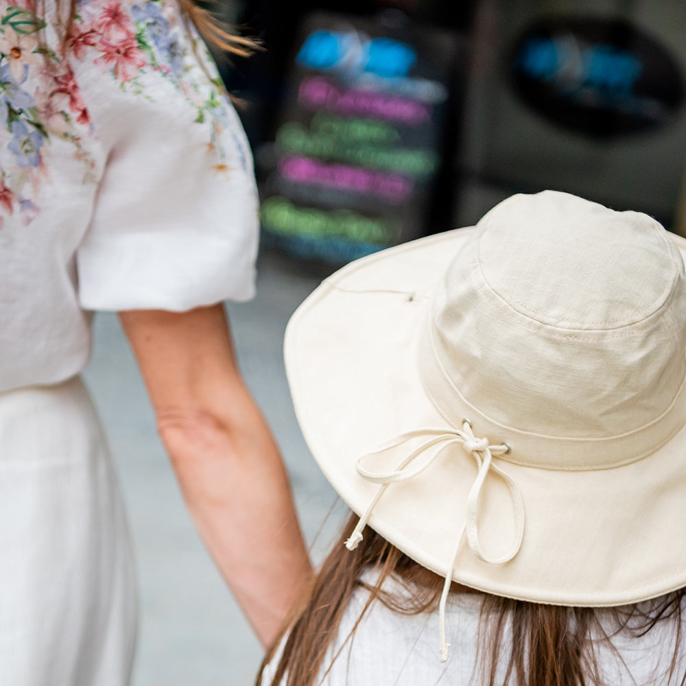 Child enjoying outdoor play in a Little Renegade Sun Hat