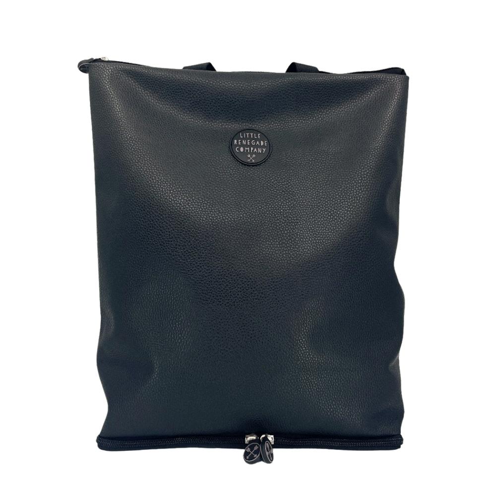 A sleek black totepack made from textured vegan leather with a minimalist design. The bag features a subtle circular logo with "Little Renegade Company" in the center. There is a zipper at the bottom of the bag, indicating the unique shake-out base. The totepack has a clean and modern appearance, ideal for versatile use.