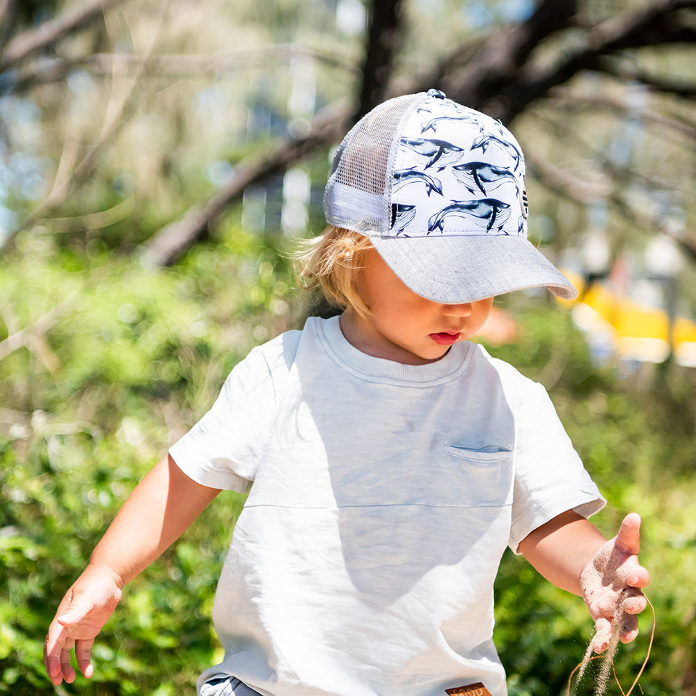 Child wearing the Pod Trucker Cap during an outdoor adventure