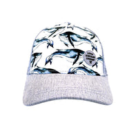 Pod Trucker Cap front view showing its watercolour whale print, textured grey curved peak and grey mesh sides