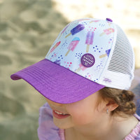 Close-up of a child wearing the Popsicle Trucker Cap showing the colourful popsicle print and purple peak