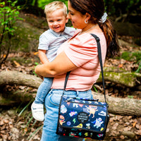 Superhero Pals Adventure Mat folded into its built-in carry bag and worn over the shoulder
