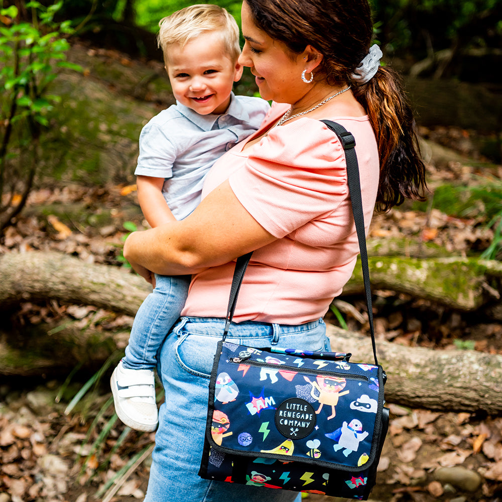 Superhero Pals Adventure Mat folded into its built-in carry bag and worn over the shoulder