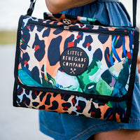 Wild Adventure Mat folded into its built-in carry bag showing its leopard and tropical leaf print
