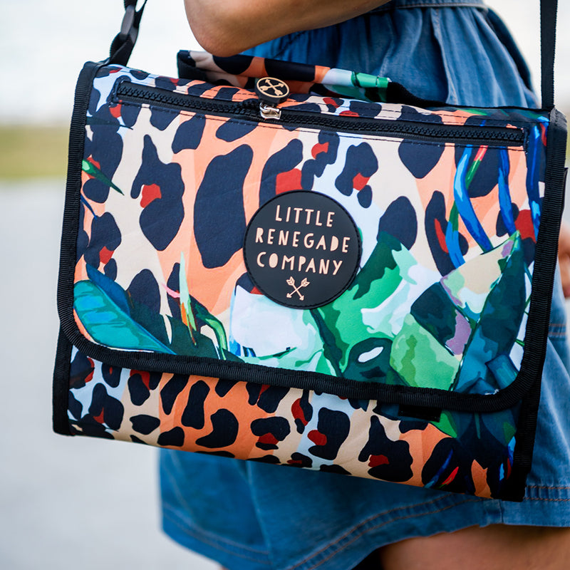 Wild Adventure Mat folded into its built-in carry bag showing its leopard and tropical leaf print