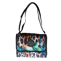 Wild Adventure Mat folded into its compact carry bag with shoulder straps visible