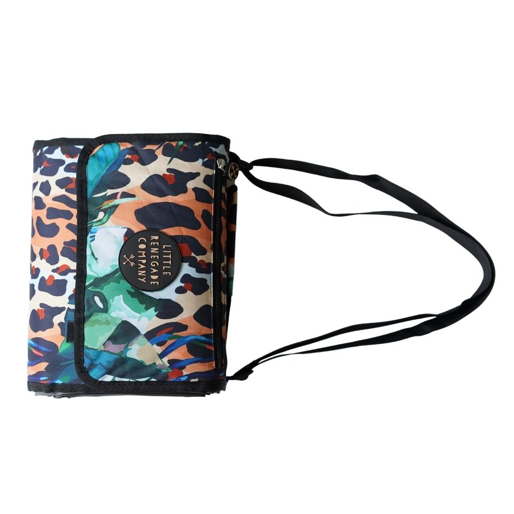 Wild Adventure Mat folded into its compact carry bag with shoulder straps visible