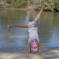Child wearing the Blush Trucker Cap during an outdoor adventure